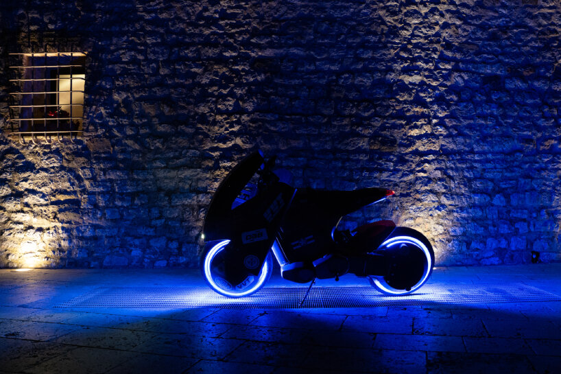 view of the two-wheeler at night with the atmospheric lighting on