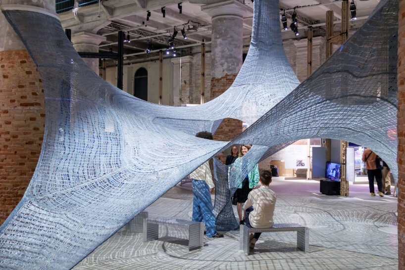 the structure hovers midair, anchored to the ground