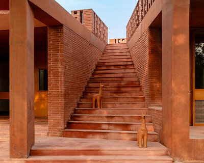 studio sangath uses recycled brick and terracotta to shape artists' refuge in india's alloa hills