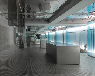 steel interiors ripple like waves in niiiz design lab’s korean swimwear store