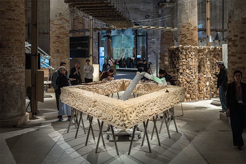 BIG's 'ancient future' fuses hand-carving and robotics at venice biennale 2025