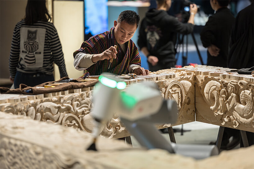 BIG's 'ancient future' fuses hand-carving and robotics at venice biennale 2025