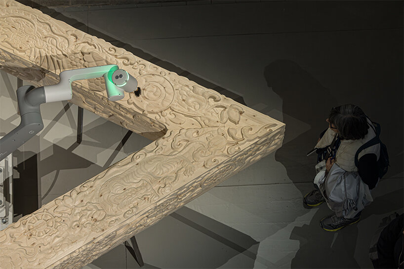 BIG's 'ancient future' fuses hand-carving and robotics at venice biennale 2025