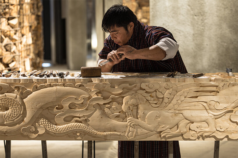 BIG's 'ancient future' fuses hand-carving and robotics at venice biennale 2025
