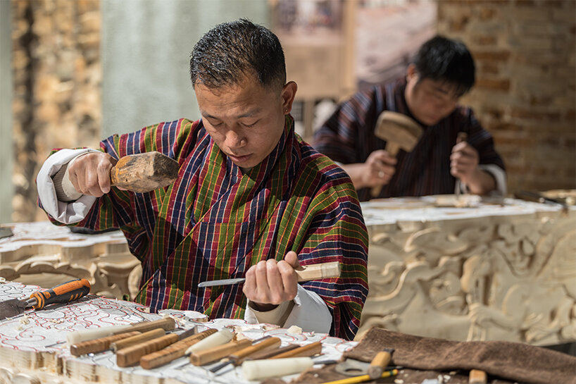 BIG's 'ancient future' fuses hand-carving and robotics at venice biennale 2025