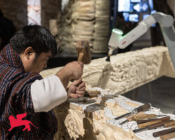 BIG’s ‘ancient future’ fuses hand-carving and robotics at venice biennale 2025