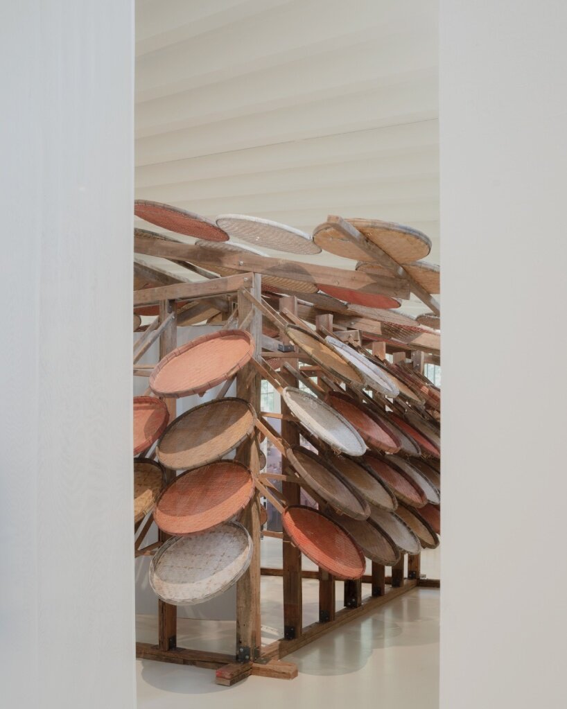 boonserm premthada upcycles thai rice barns for elephant food shelter at triennale milano