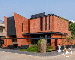 red brick and black basalt wrap abhishek ajmera's house in india with tactility