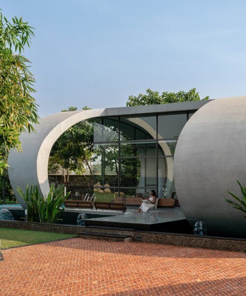 carapace house by achyutam designs carves into tubular concrete volumes in india