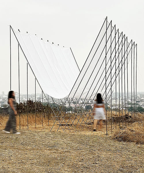 translucent fabric binds horizon pavilion's arrayed metal frame atop of ecuador hillside