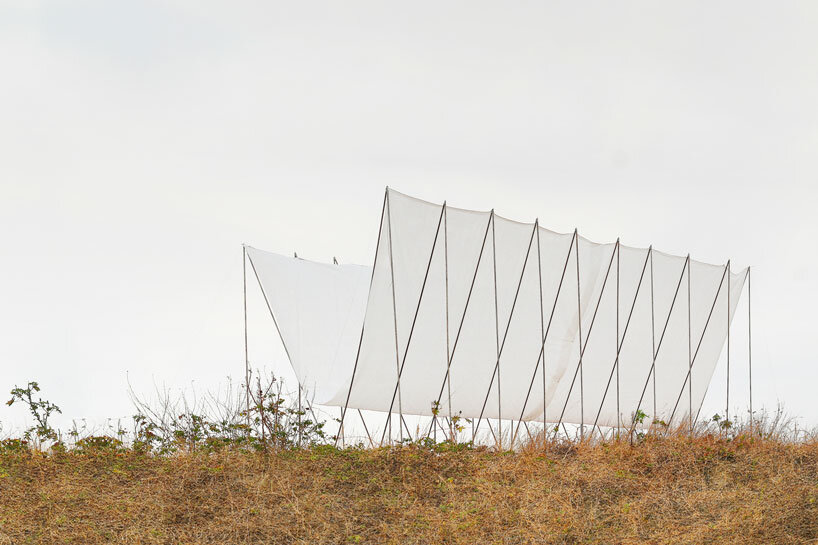 translucent fabric binds horizon pavilion's arrayed metal frame atop of ecuador hillside