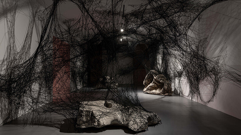 chiharu shiota suspends butterfly wings over warm bed at beijing's red brick art museum