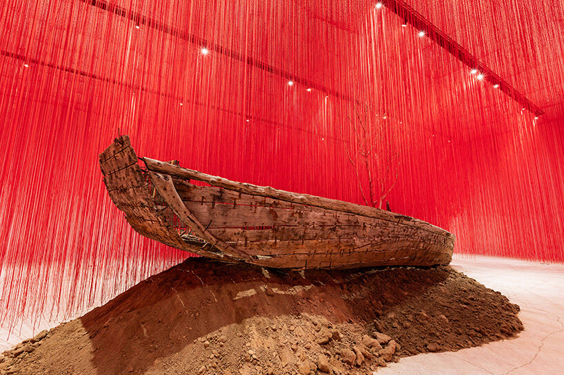 chiharu shiota suspends butterfly wings over warm bed at beijing's red brick art museum
