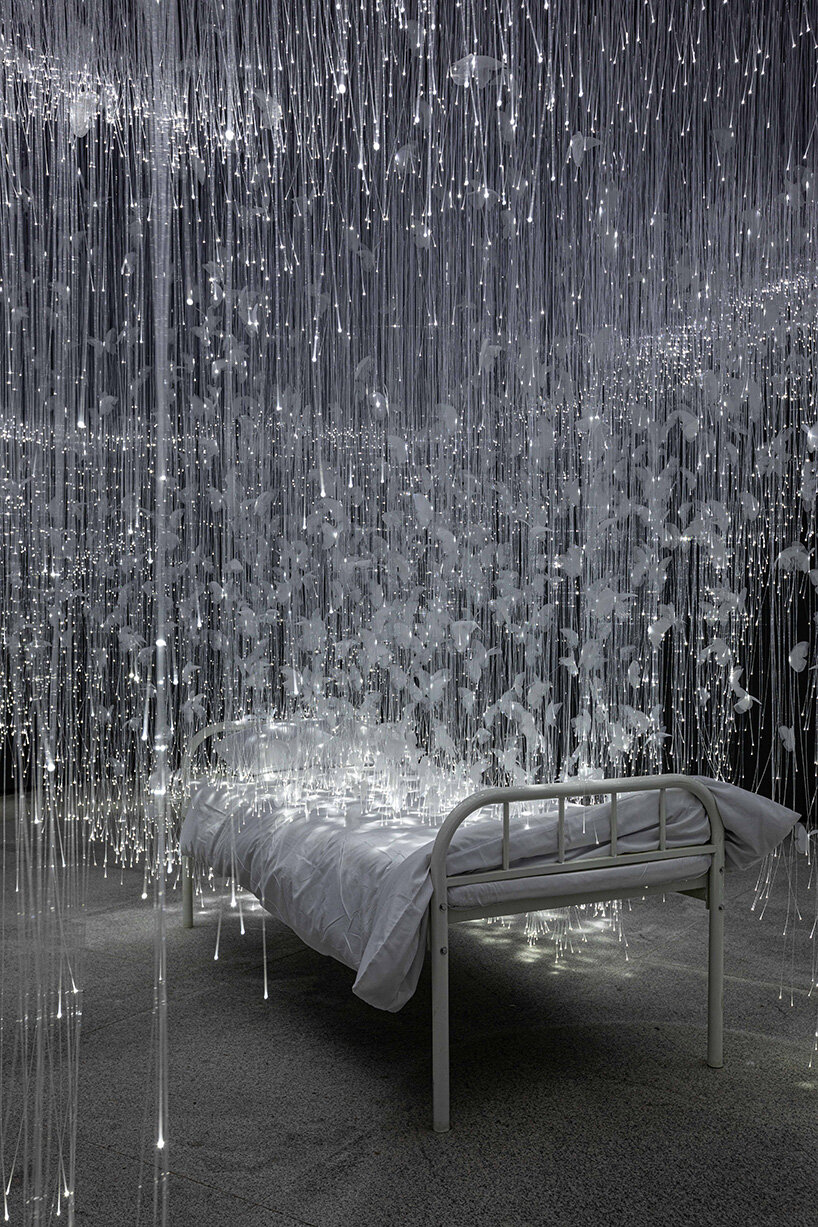 chiharu shiota suspends butterfly wings over warm bed at beijing's red brick art museum