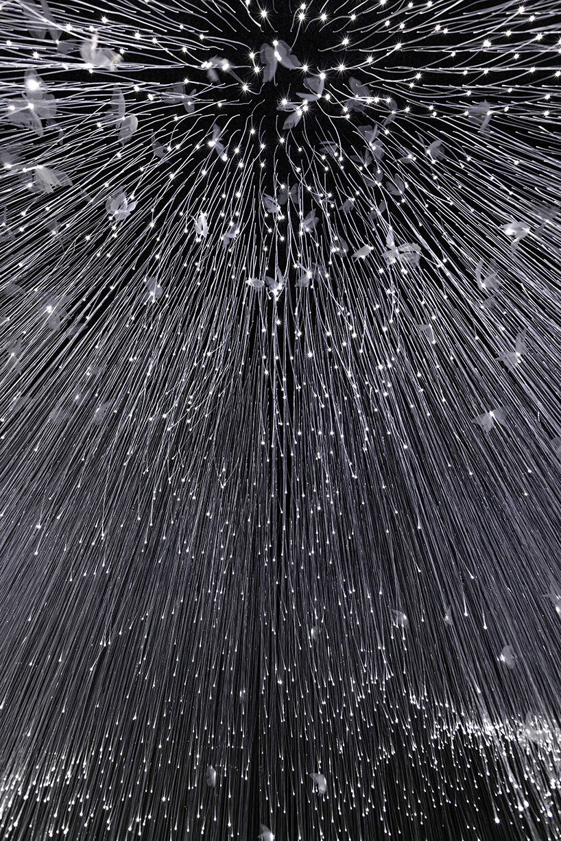 chiharu shiota suspends butterfly wings over warm bed at beijing's red brick art museum