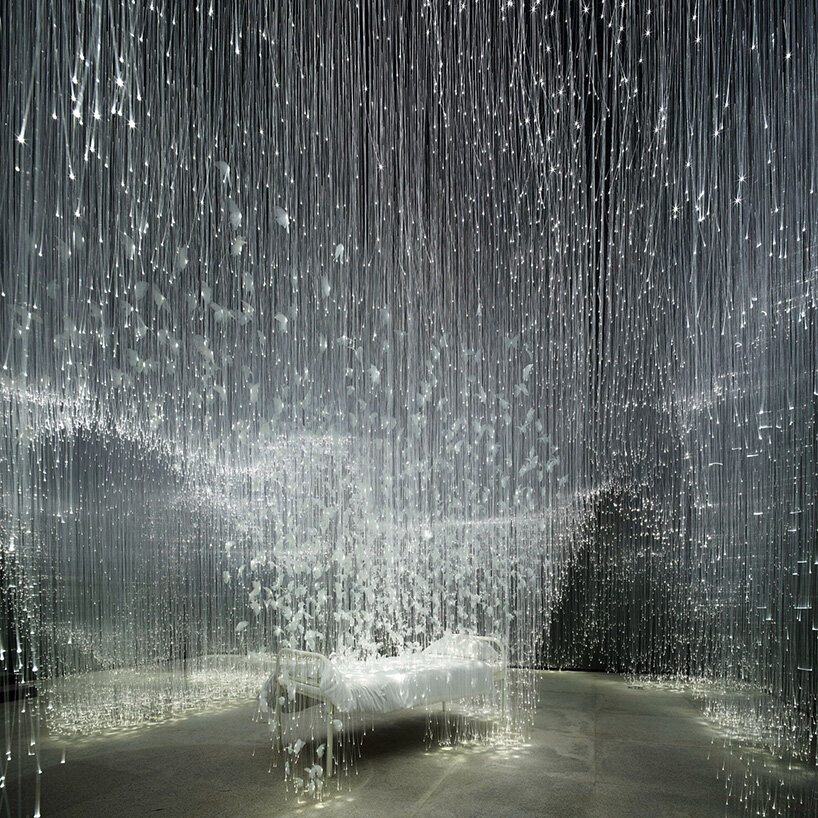 chiharu shiota suspends butterfly wings over warm bed at beijing's red brick art museum