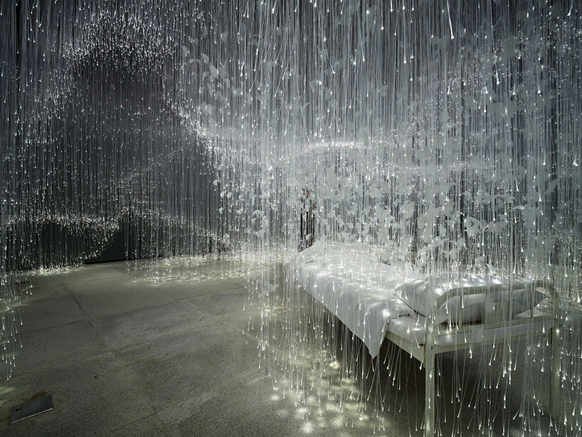 chiharu shiota suspends butterfly wings over bed in beijing show