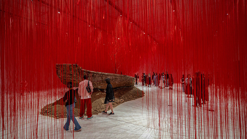 chiharu shiota suspends butterfly wings over warm bed at beijing's red brick art museum