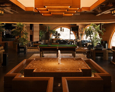 tibetan-style columns & antique furniture enliven wooton designers' chimp club café & bar