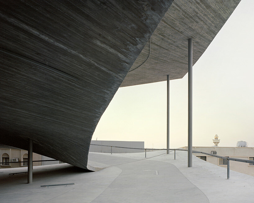 christian kerez eliminates ramps in bahrain car parks with sloping concrete geometries