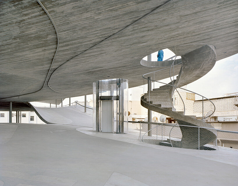 christian kerez eliminates ramps in bahrain car parks with sloping concrete geometries