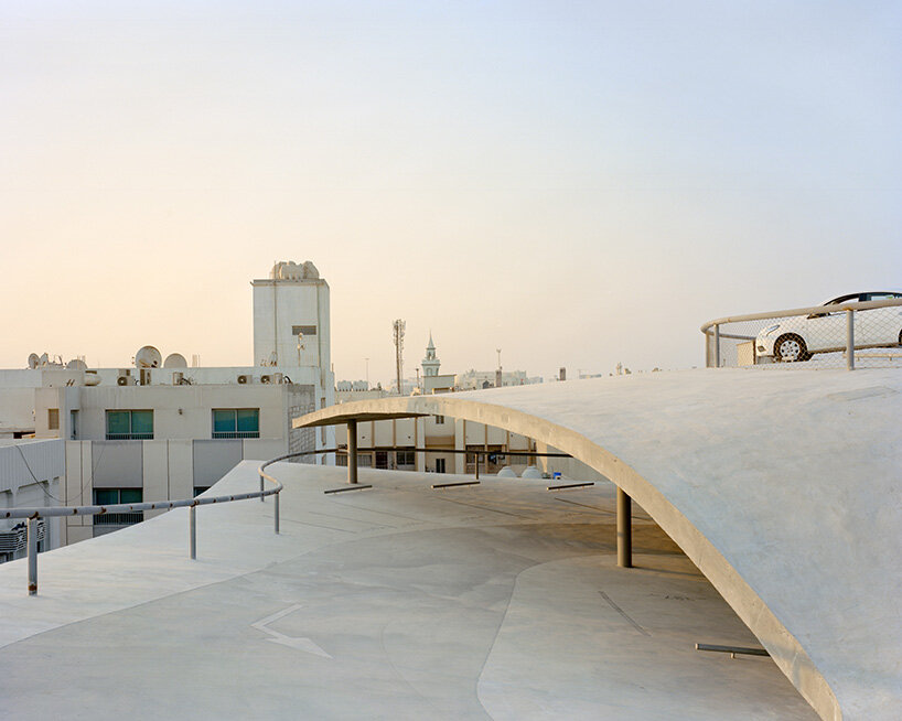 christian kerez eliminates ramps in bahrain car parks with sloping concrete geometries