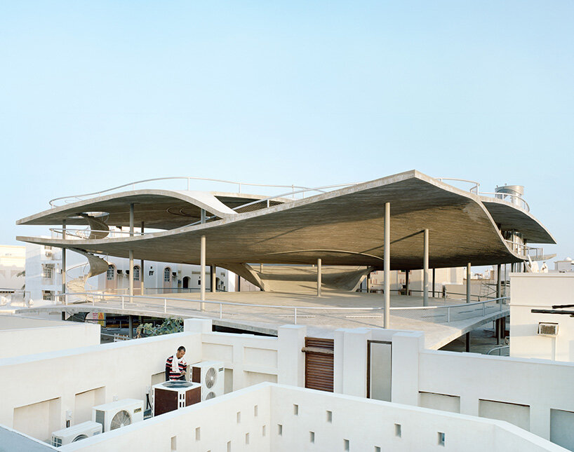 christian kerez eliminates ramps in bahrain car parks with sloping concrete geometries