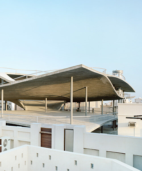 christian kerez eliminates ramps in bahrain car parks with sloping concrete geometries