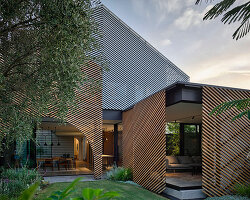 austin maynard architects updates 'clarke' house with timber battens and pocket gardens