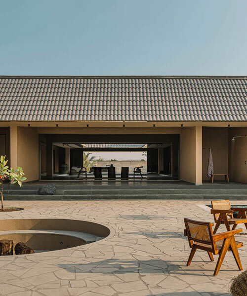 sculpted shell of stone and plaster encircles courtyard house by d’well in india