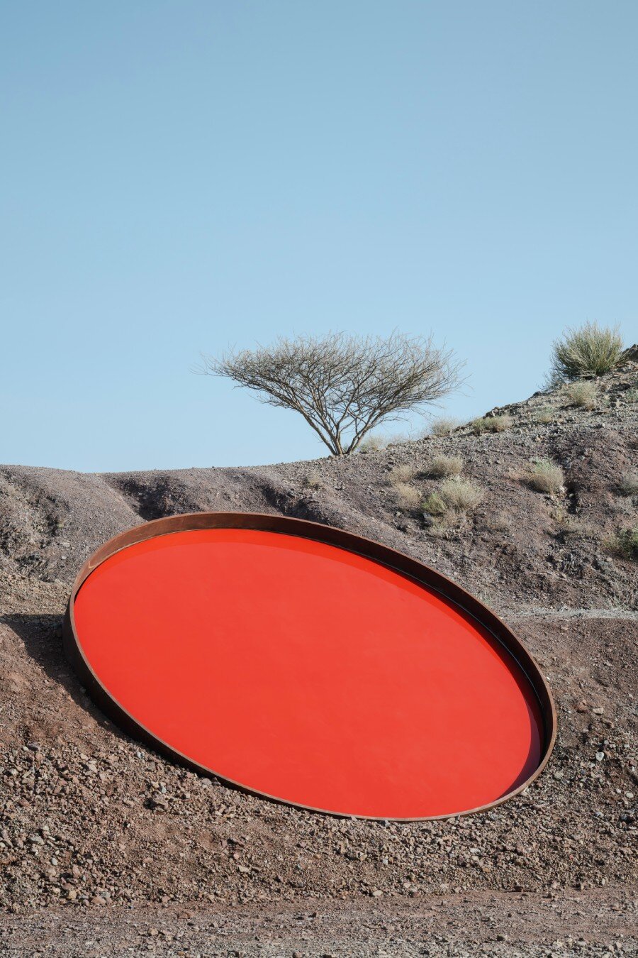 five metallic discs carve shaikha al mazrou's contemplative sculpture trail in UAE mountains