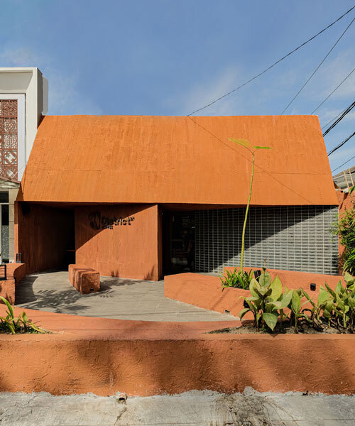 terracotta-tinted concrete district 27 coffee shop reuses old medical laboratory in indonesia