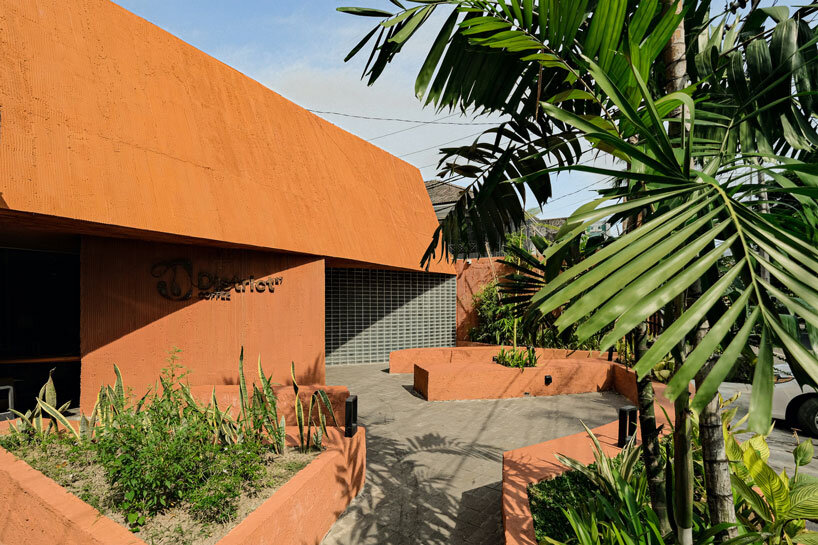 Concrete coffee shop with terracotta shades 27 coffee reuses the old medical laboratory in Indonesia
