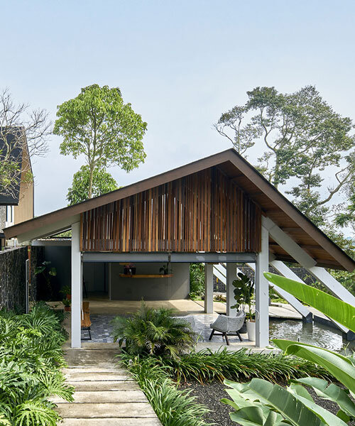 e.Re studio architects coats lenirra villas' gables in dark-toned roof shingles