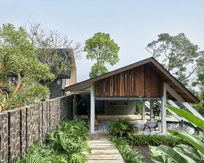 e.Re studio architects coats lenirra villas' gables in dark-toned roof shingles