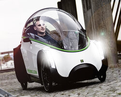 electric podbike frikar encloses riders with dome windshield to protect them in cold weather