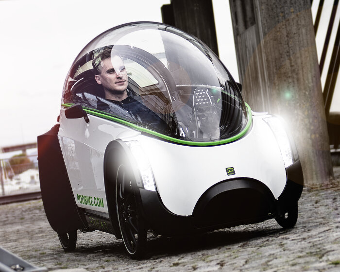electric podbike frikar encloses riders with dome windshield to protect them in cold weather