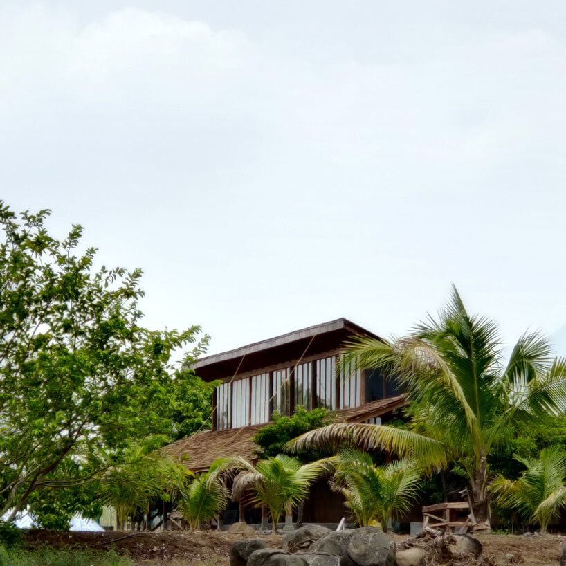 metis practice combines wooden shingles and copper for pali farmhouse's roofing in india