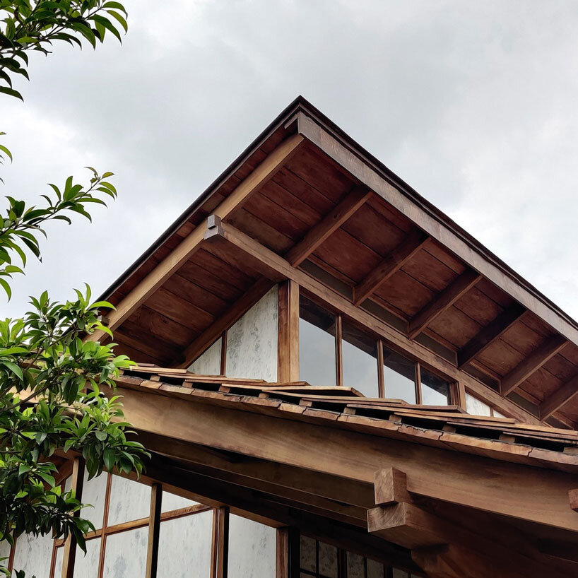 metis practice combines wooden shingles and copper for pali farmhouse's roofing in india