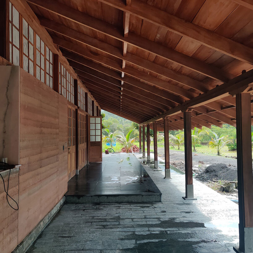 metis practice combines wooden shingles and copper for pali farmhouse's roofing in india
