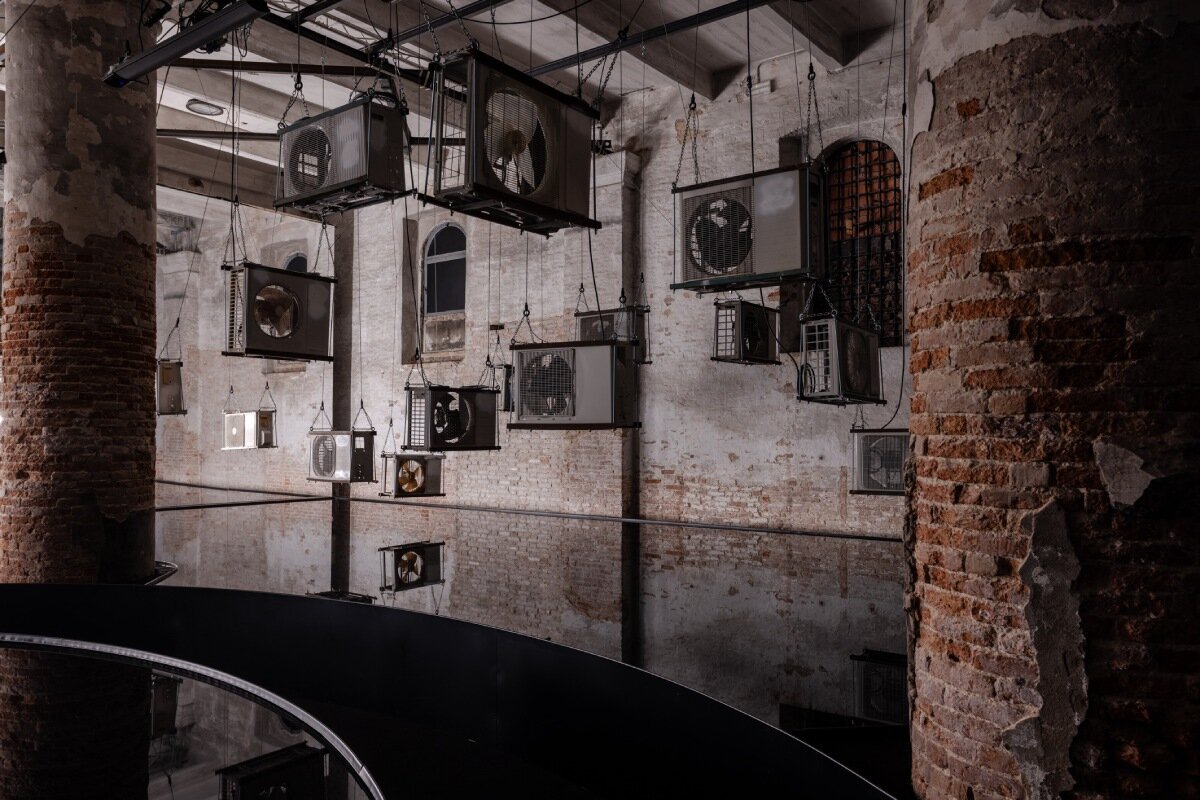suspended air conditioners & water pools confront global energy impacts at venice biennale