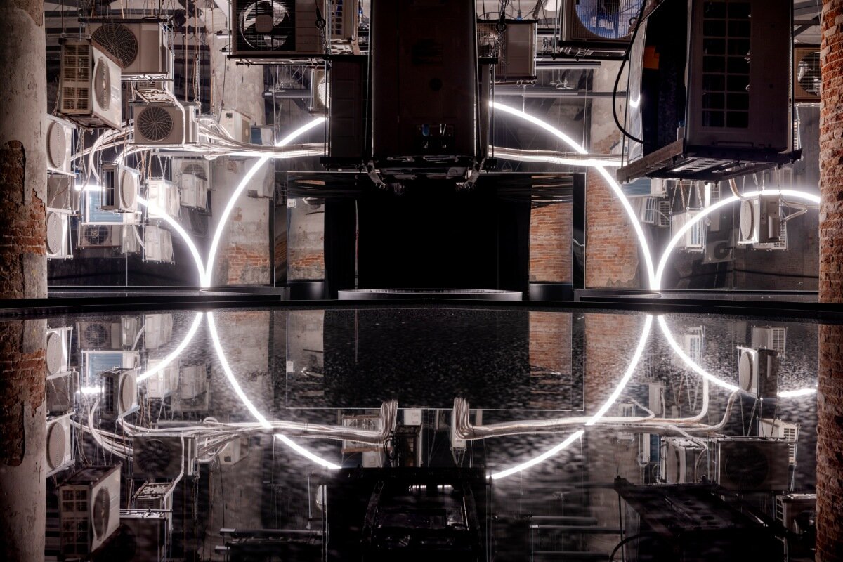suspended air conditioners and water pools confront global energy impacts at venice architecture biennale