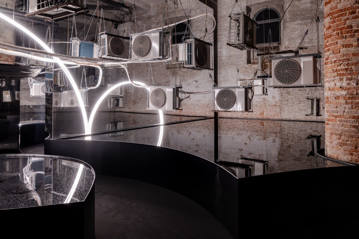 suspended air conditioners and water pools confront global energy impacts at venice architecture biennale