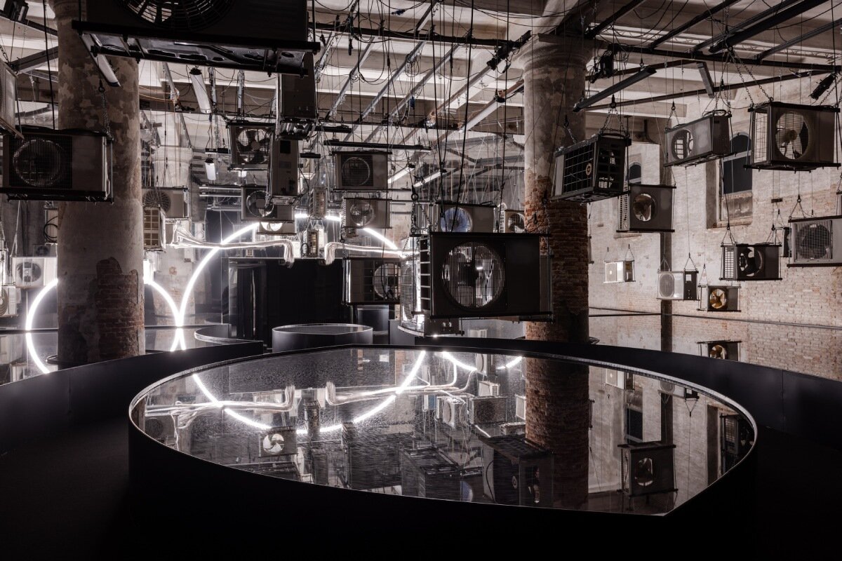 suspended air conditioners and water pools confront global energy impacts at venice architecture biennale