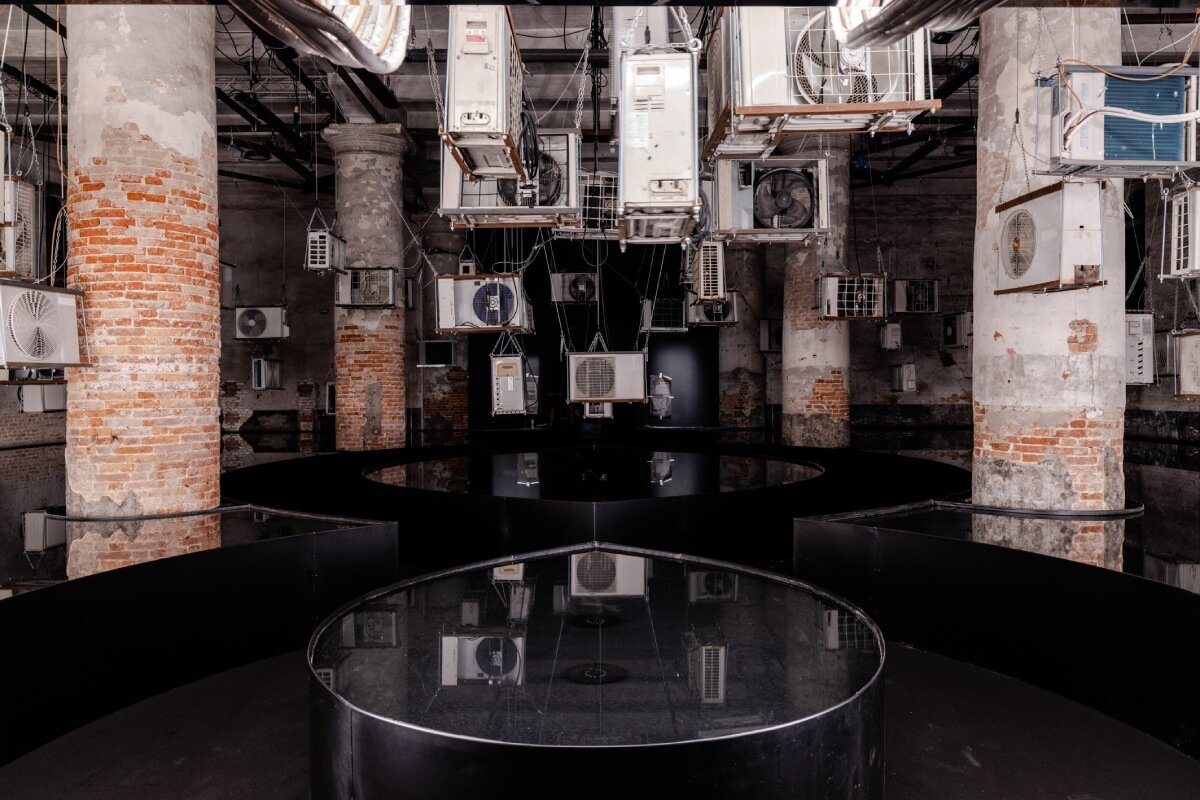 suspended air conditioners and water pools confront global energy impacts at venice architecture biennale
