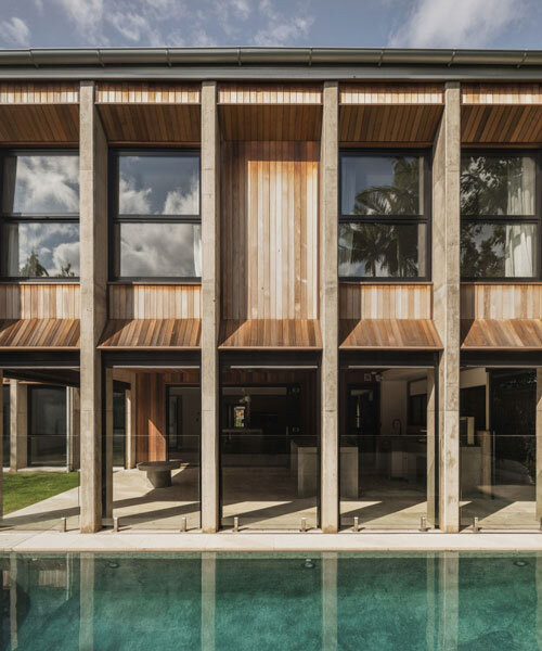 bold concrete frame by george kouparitsas reshapes pre-war cottage's facade in australia