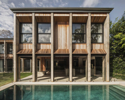 bold concrete frame by george kouparitsas reshapes pre-war cottage's facade in australia