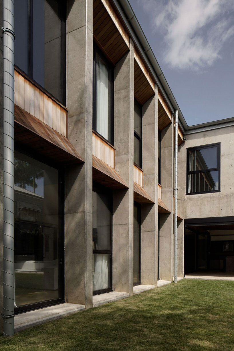bold concrete frame by george kouparitsas reshapes pre-war cottage's facade in australia