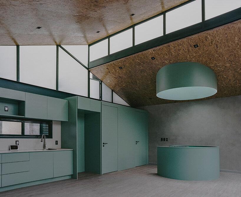 green metal accents bring color to amasa estudio's 1940s home renovation in mexico city