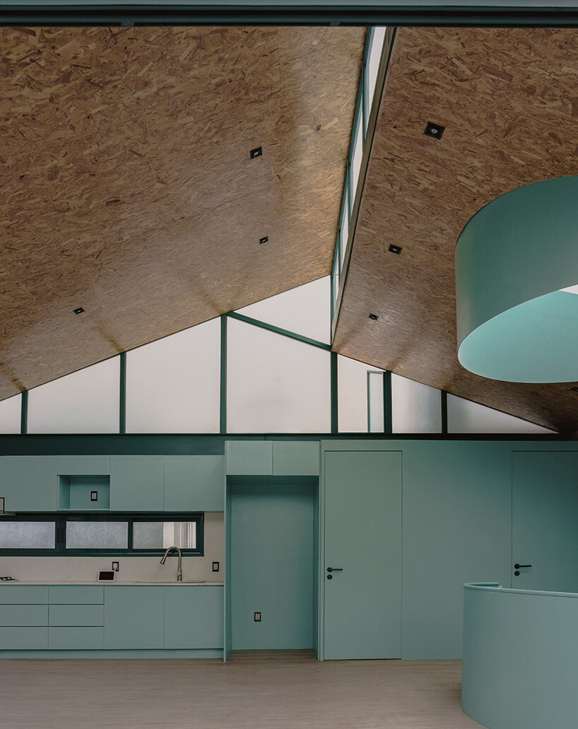 green metal accents bring color to amasa estudio's 1940s home renovation in mexico city